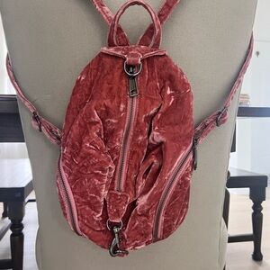 Pink Backpack with Glossy Finish and Organic Design